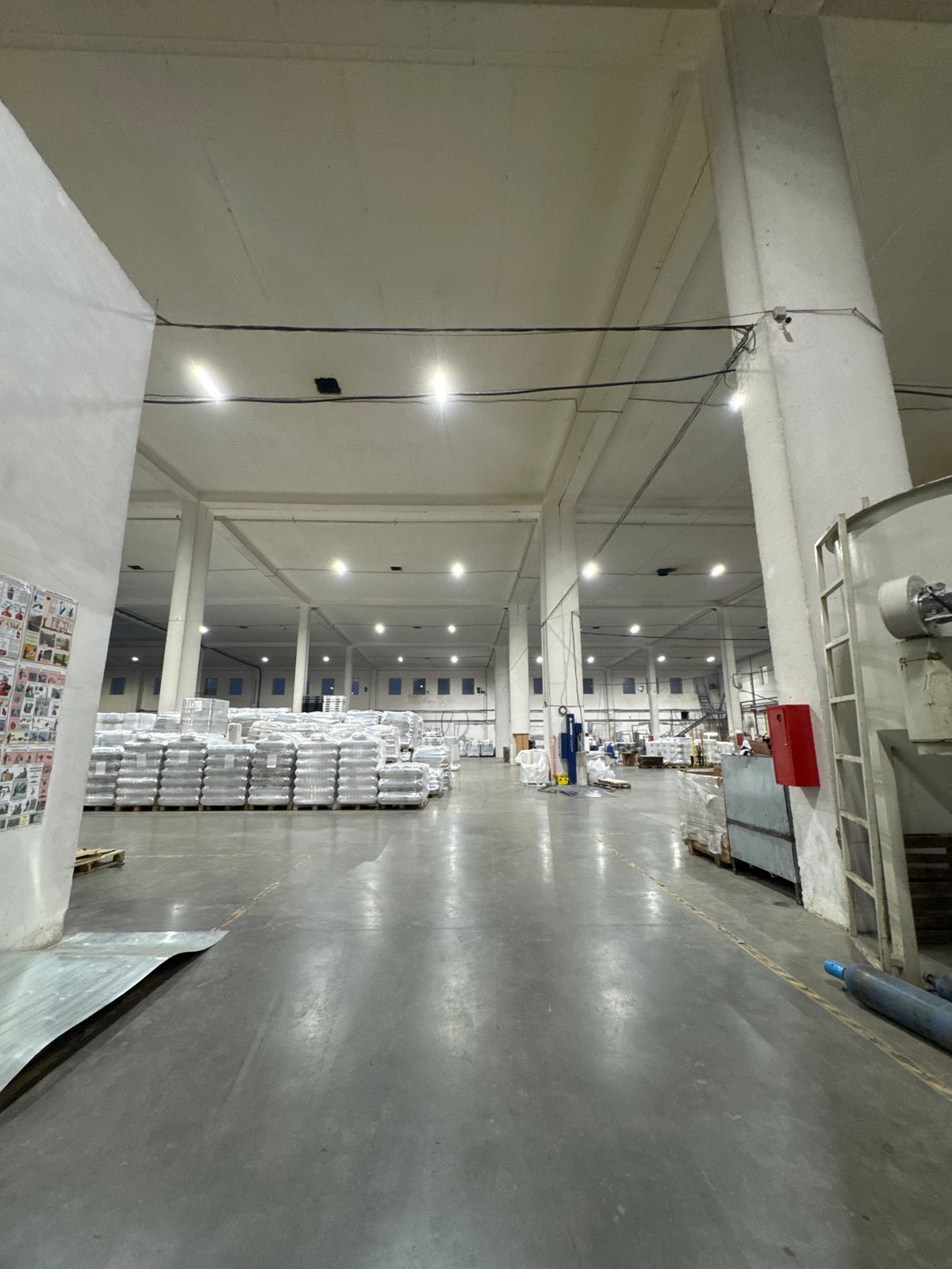 Inside and outside a Perm plastics facility at dusk
