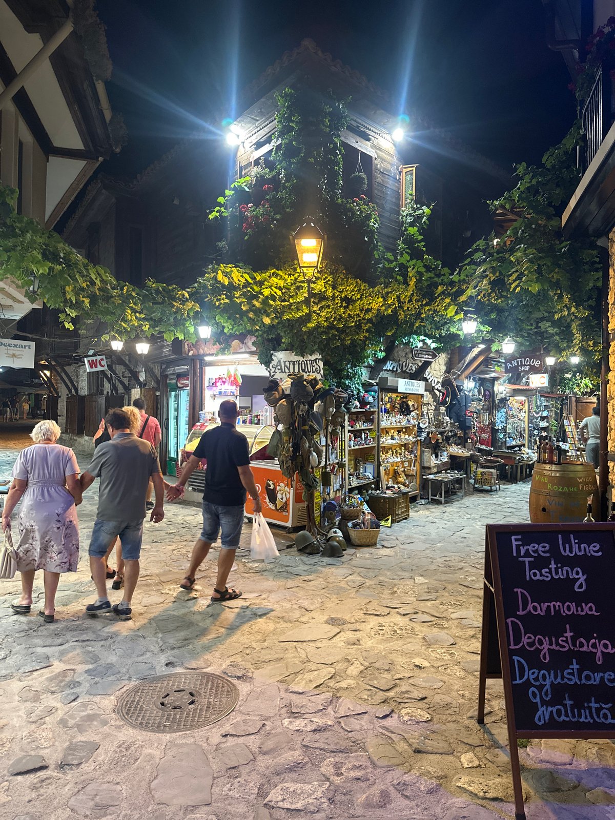 Nesebar old town at night, cobblestones and wine shops