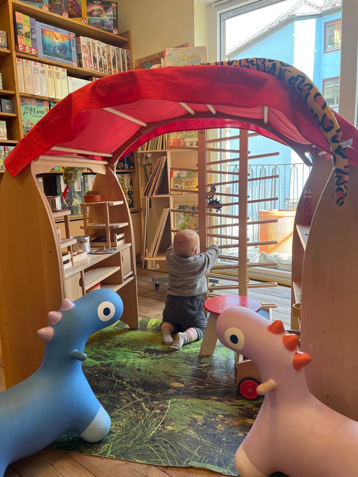 Family explores Munich's Marienplatz with toddler, visits shops and cafes