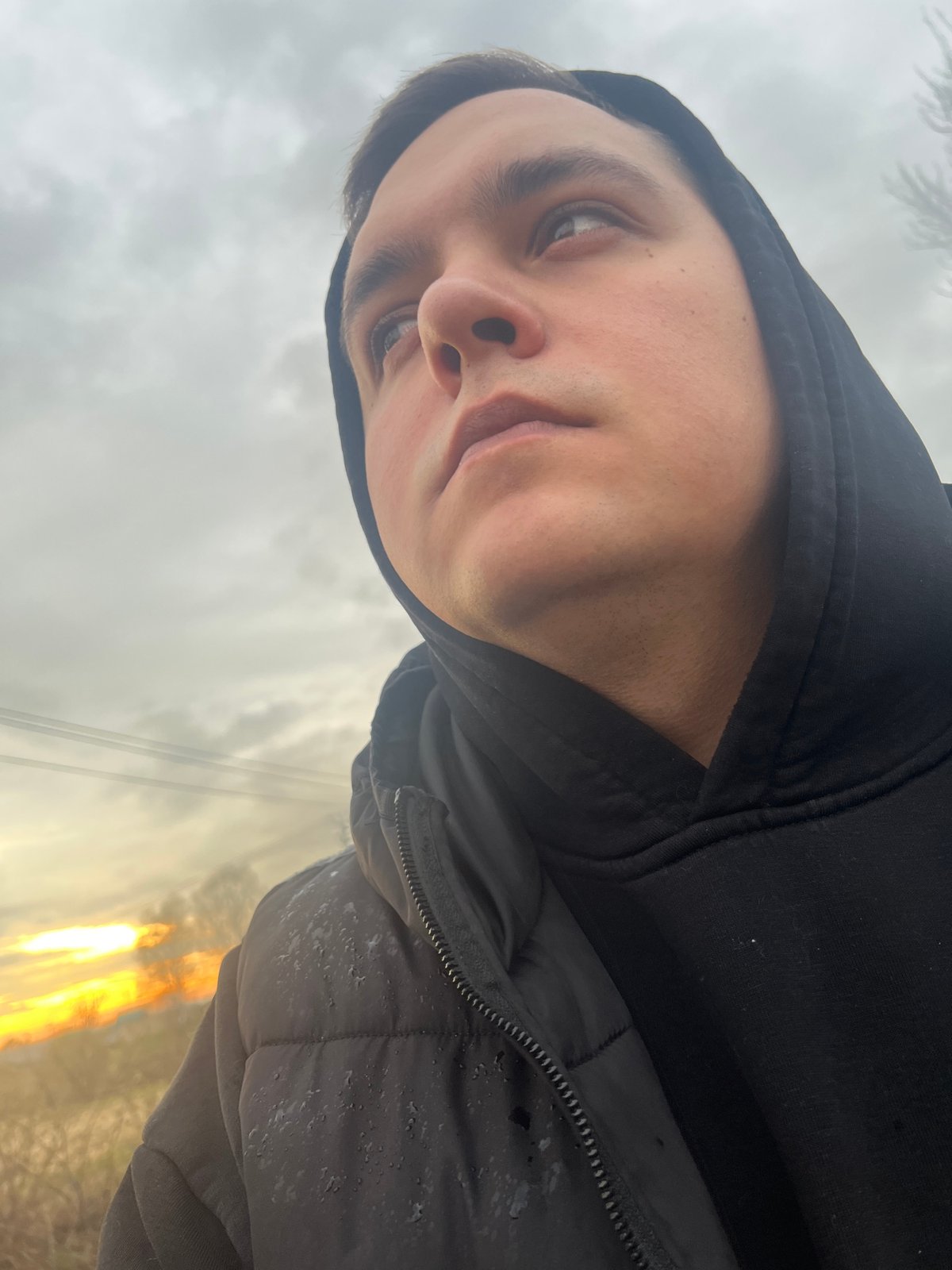 Person takes outdoor selfies in rural Russian village