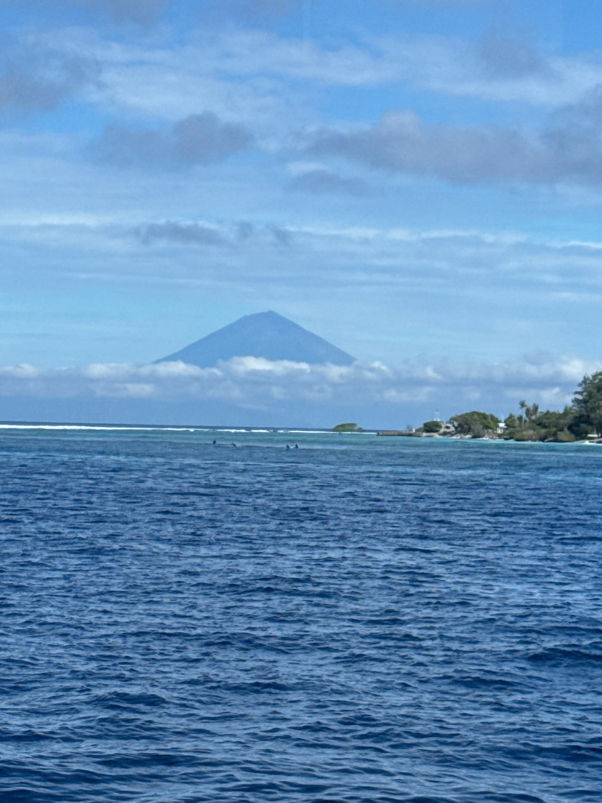 Indonesian coastal waters see routine boat activity, dock scenes