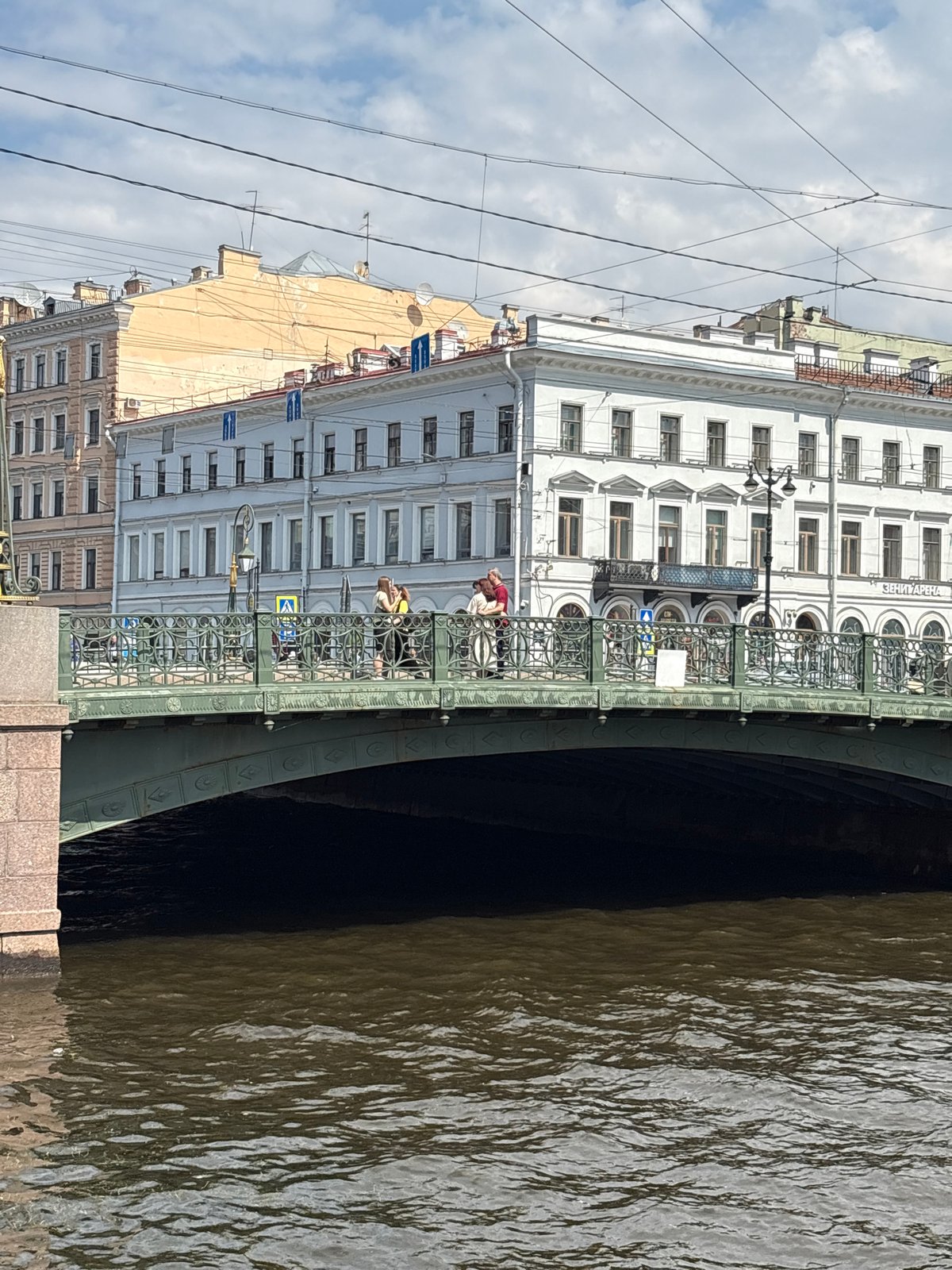Strolling Saint Petersburg's canals and grand facades on a cloudy afternoon