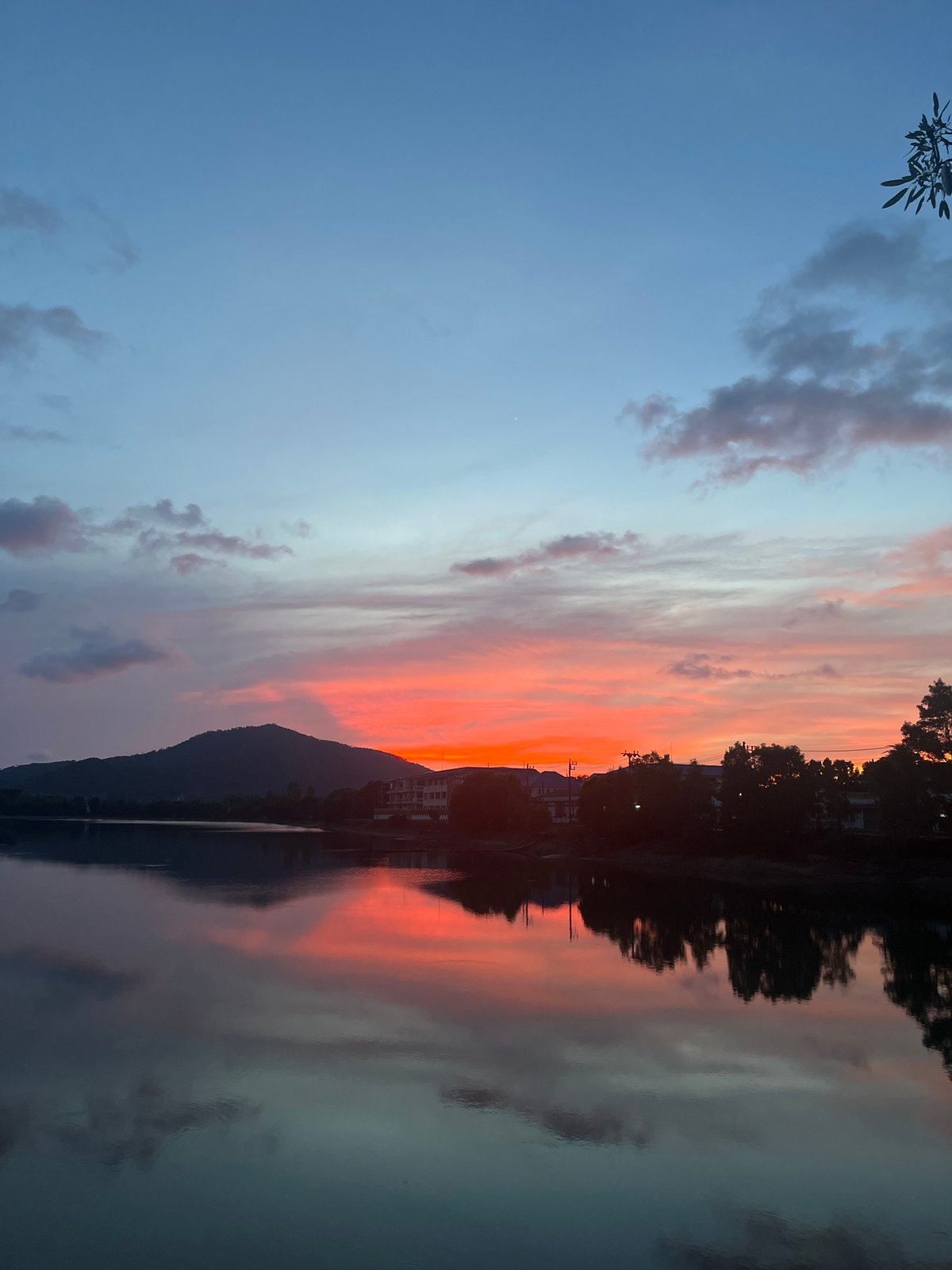 Sunset observed over water in Baan Harn, Thailand