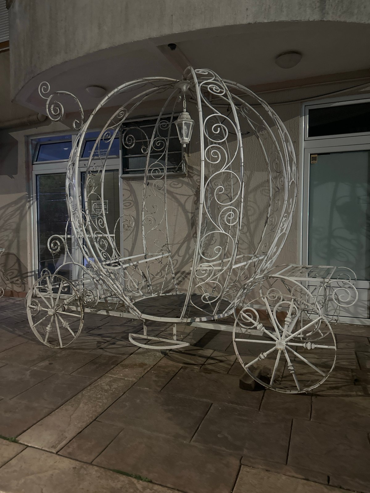 Evening moments captured in Budva: decorative carriage, woman with beer