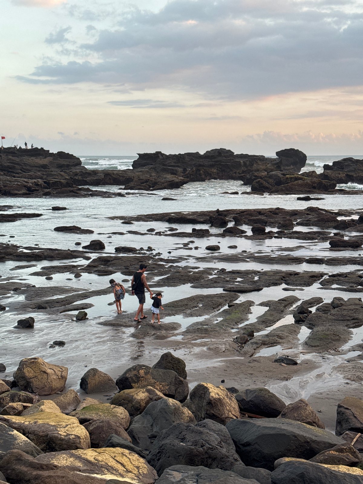 Peaceful rocky coastline documented in Mengwi, Indonesia