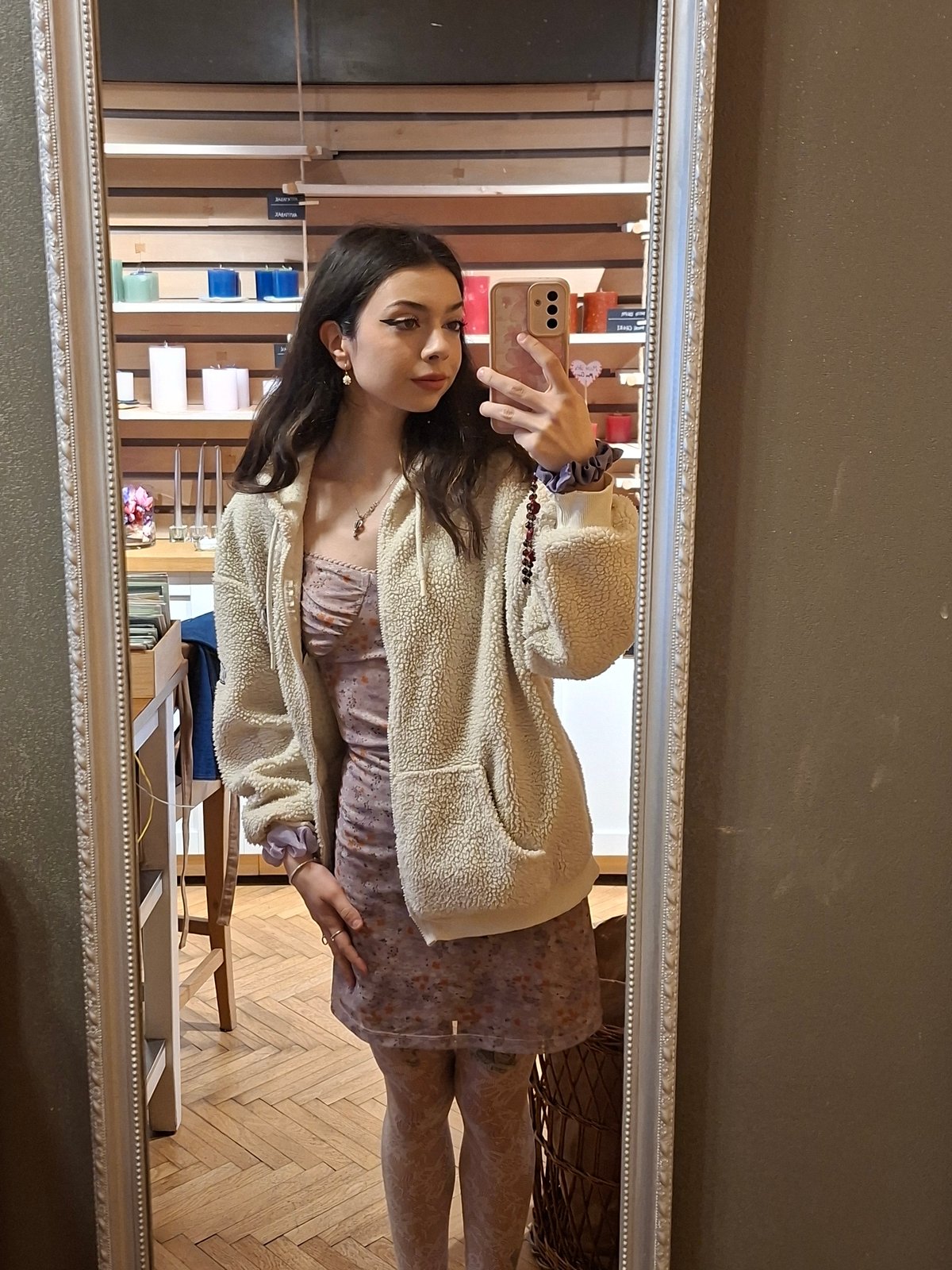 Woman takes mirror selfie in floral dress in Sofia