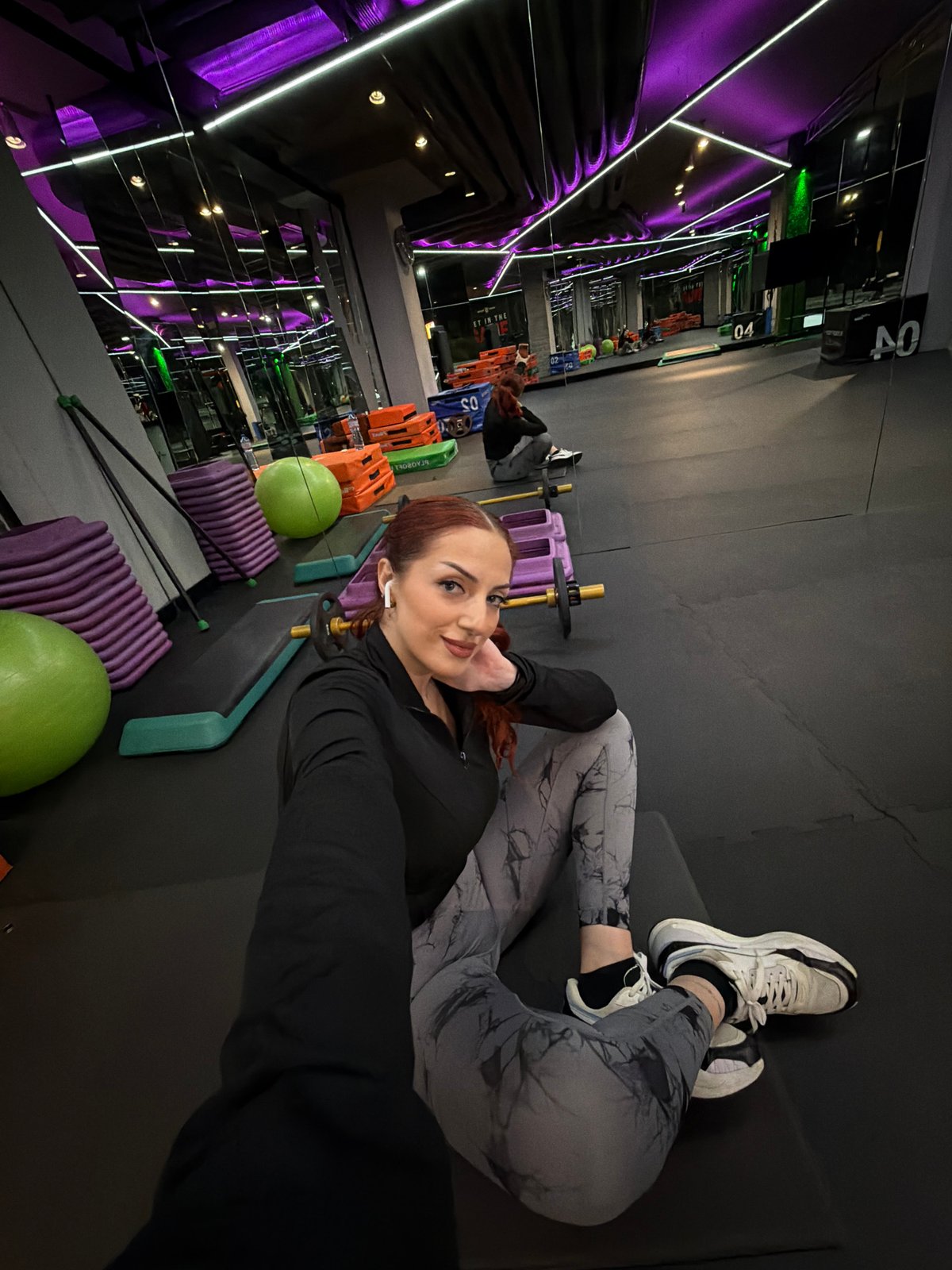 Woman exercising at Sofia gym during evening workout session