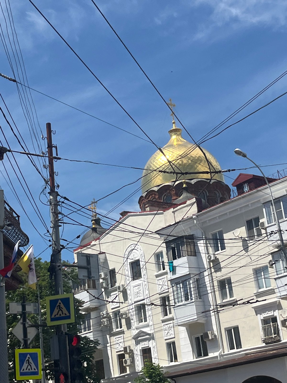 Daily street scenes documented across Krasnodar during sunny afternoon