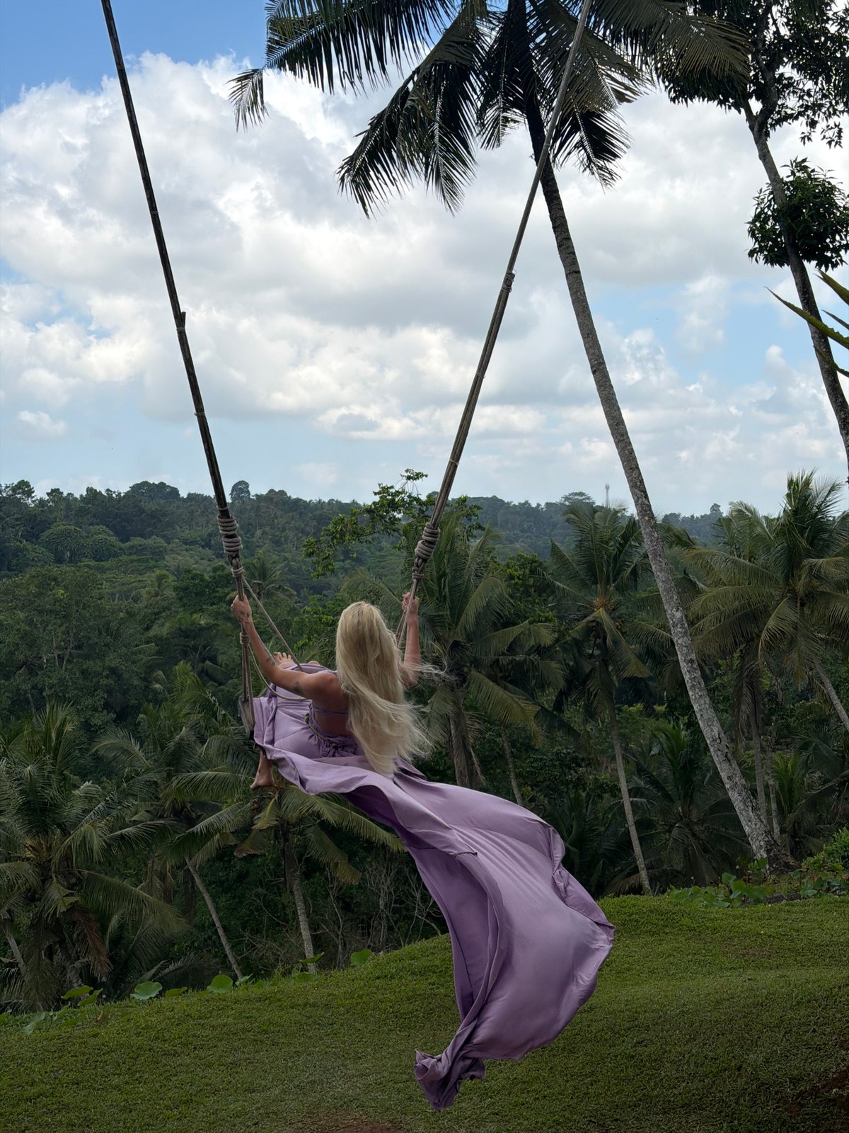 Woman enjoys swing and selfies at Indonesia resort