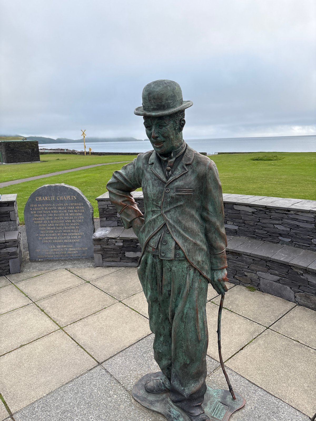 Charlie Chaplin bronze statue overlooking Waterville's coastal landscape