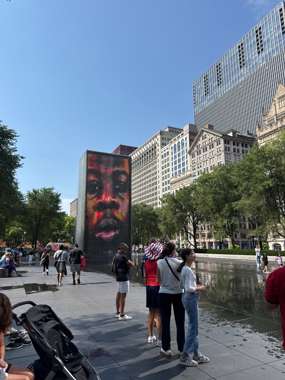 Crown Fountain draws a crowd on a sunny Fourth of July