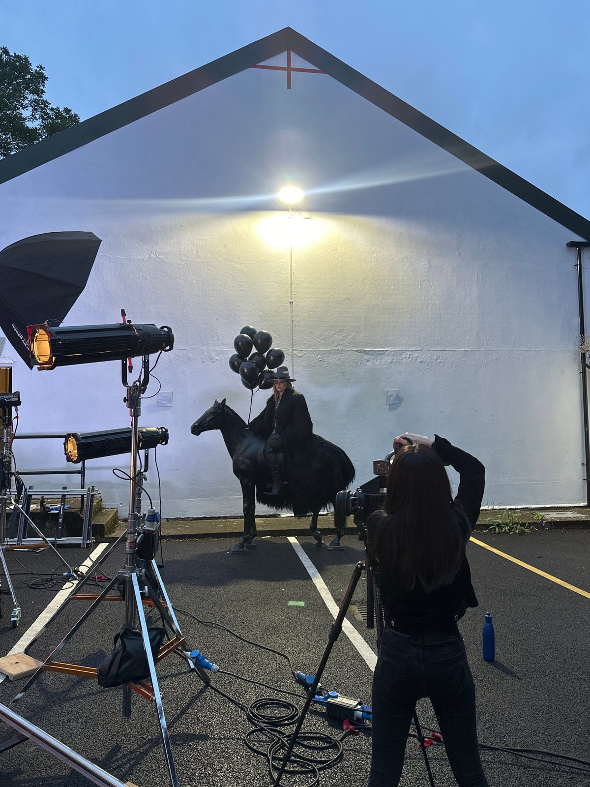 Outdoor photoshoot with horse prop filmed in London parking lot