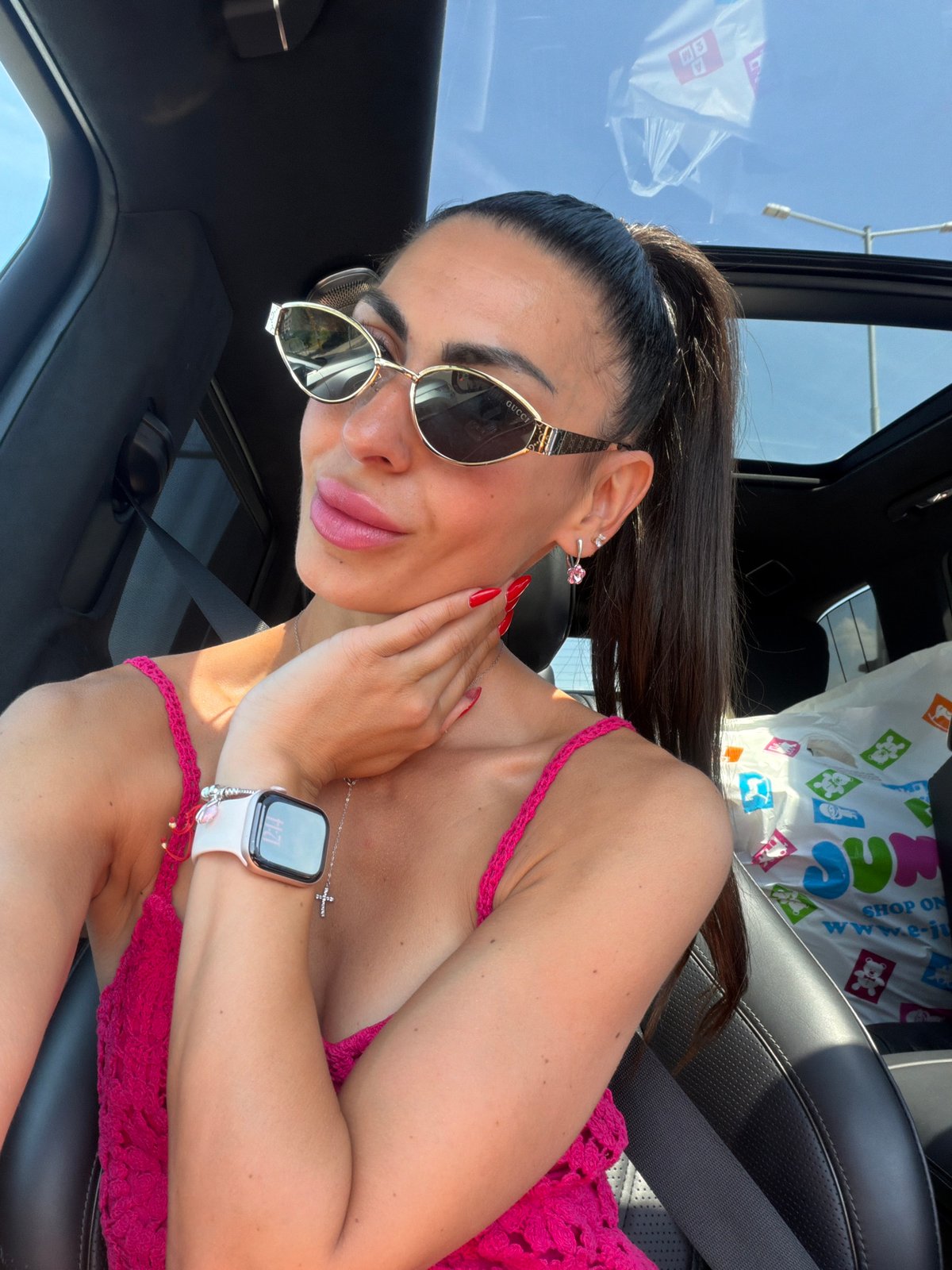Inside a car in Sofia, styled in pink and Gucci shades.