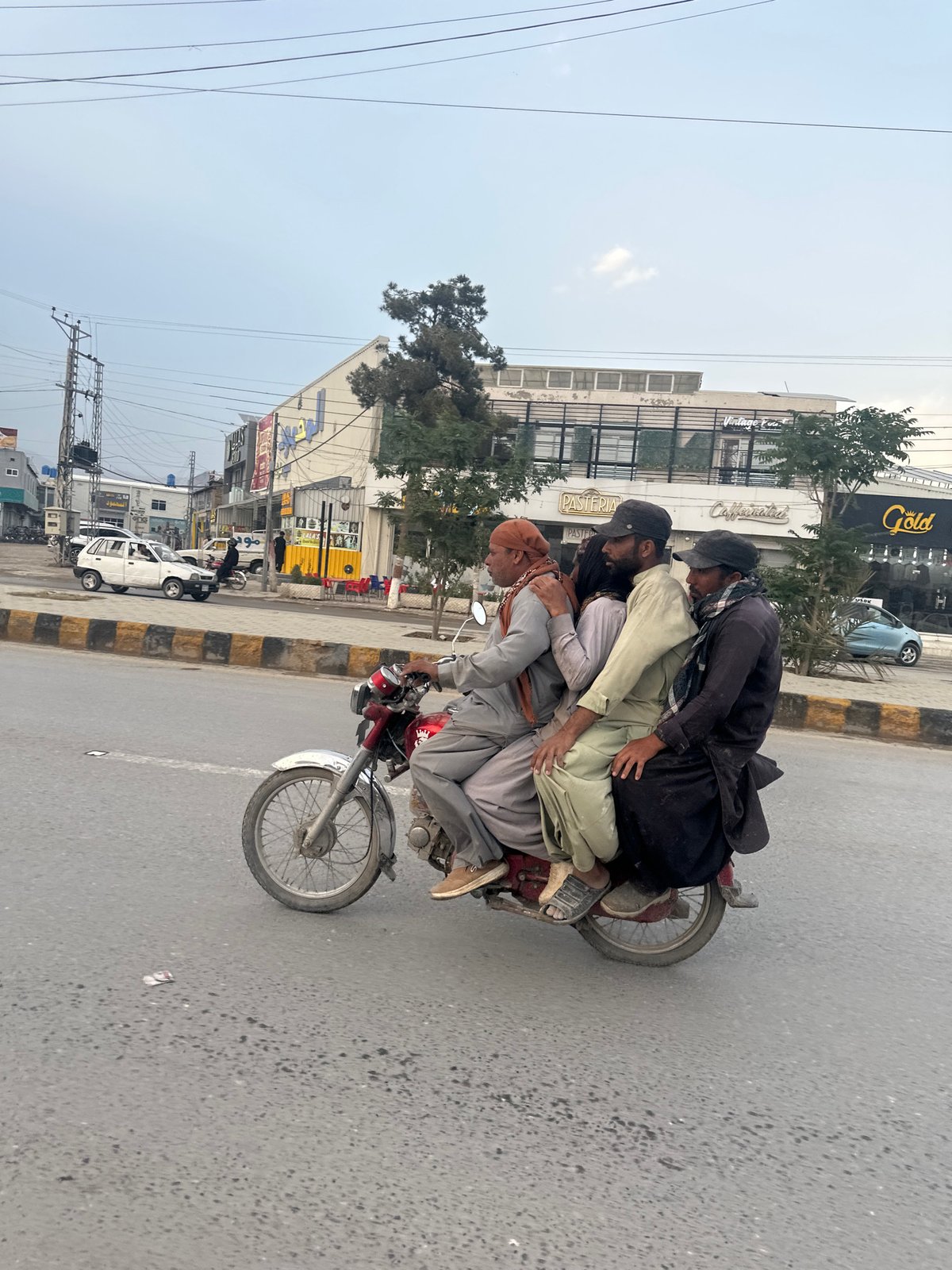 Multiple riders share motorcycles on Quetta streets