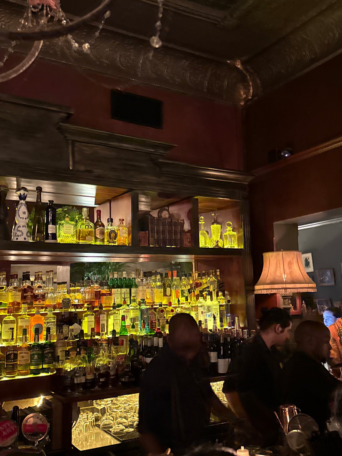 Evening social gathering at ornate Cape Town bar documented