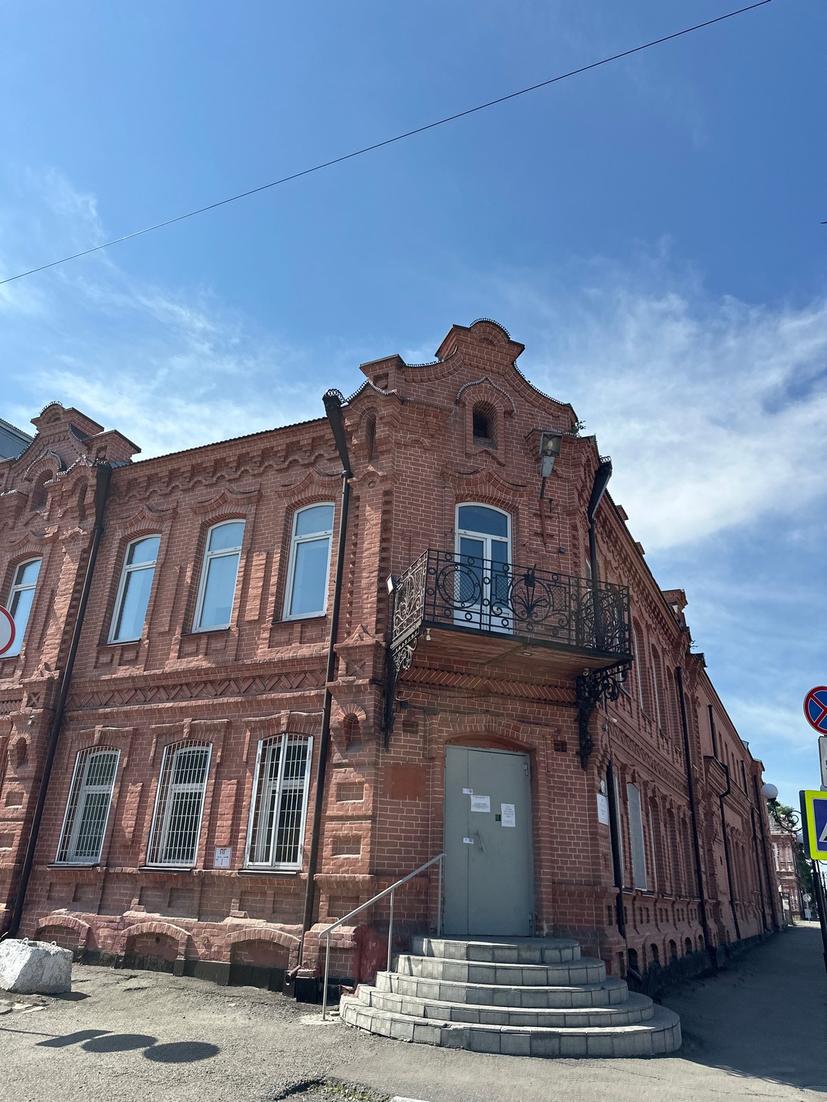 Historic church, red brick buildings, and a carousel in Biysk