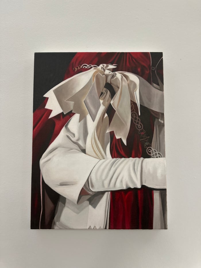 Oil painting of figure observed on white wall in London