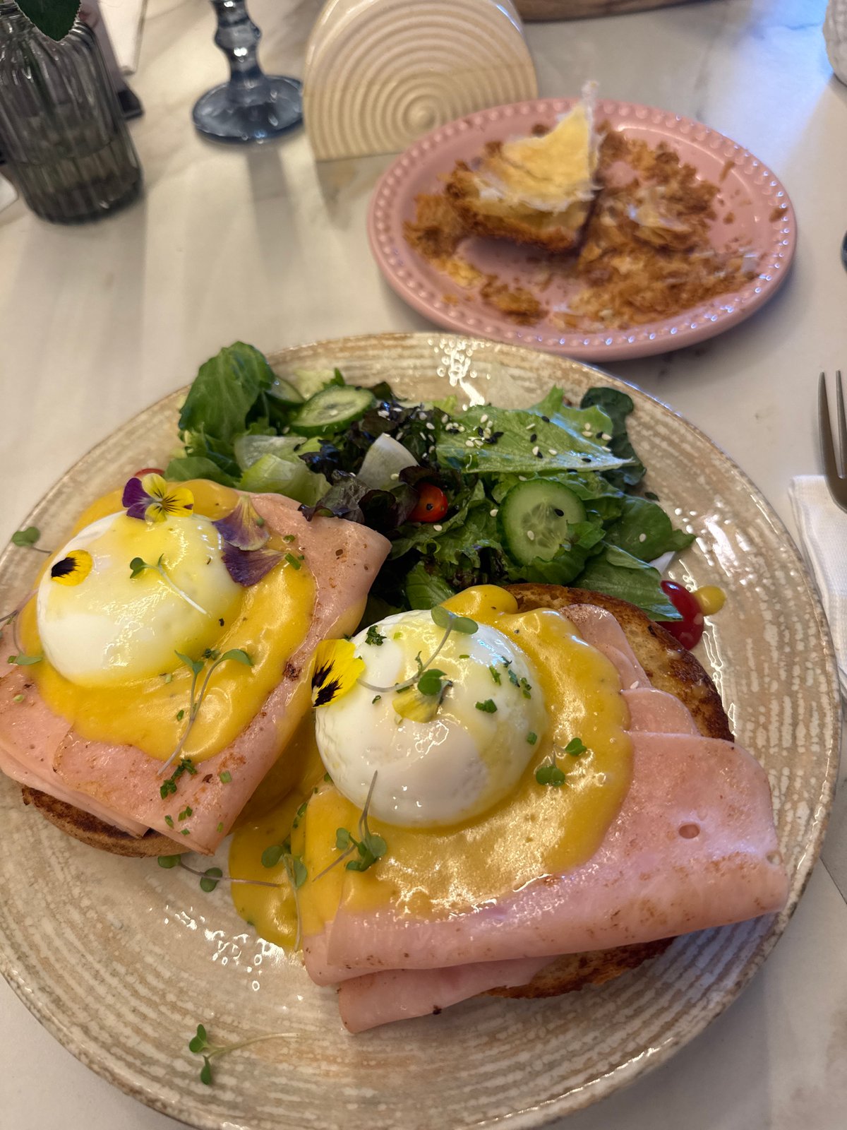 Diner enjoys Eggs Benedict meal at Puebla restaurant