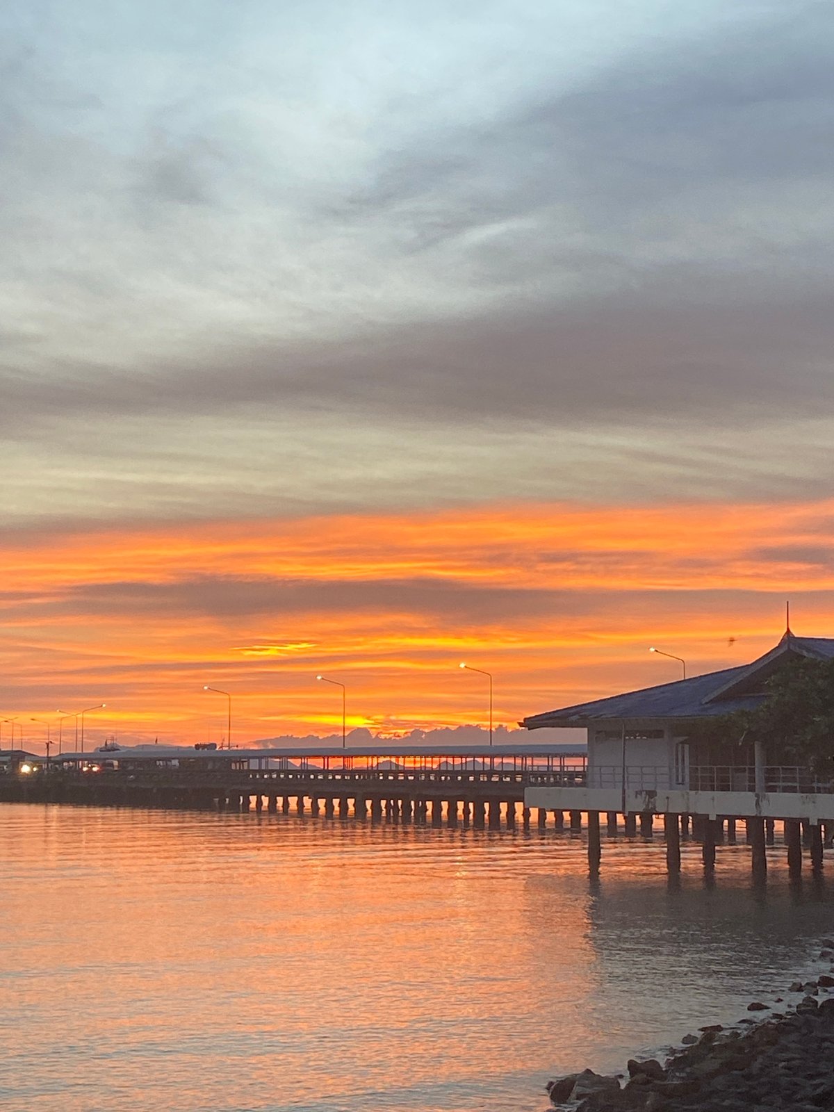 Nathon port at golden hour, ferry docked, sky on fire