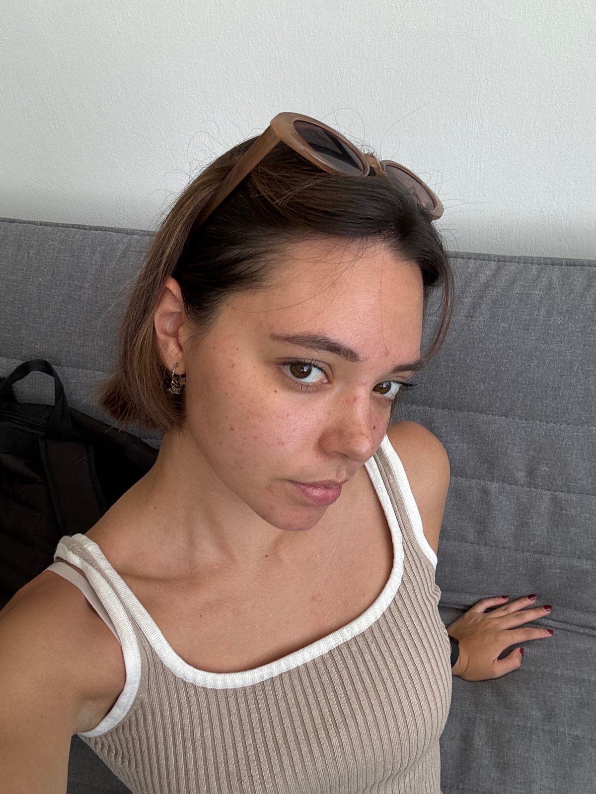 Woman rests on couch in San Bernardino Tlaxcalancingo