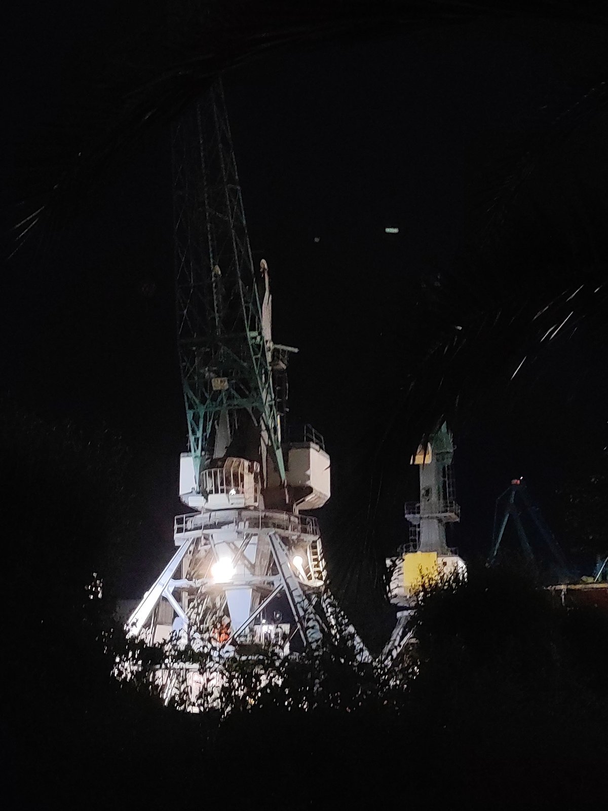 Batumi port district at night, cranes to café signs