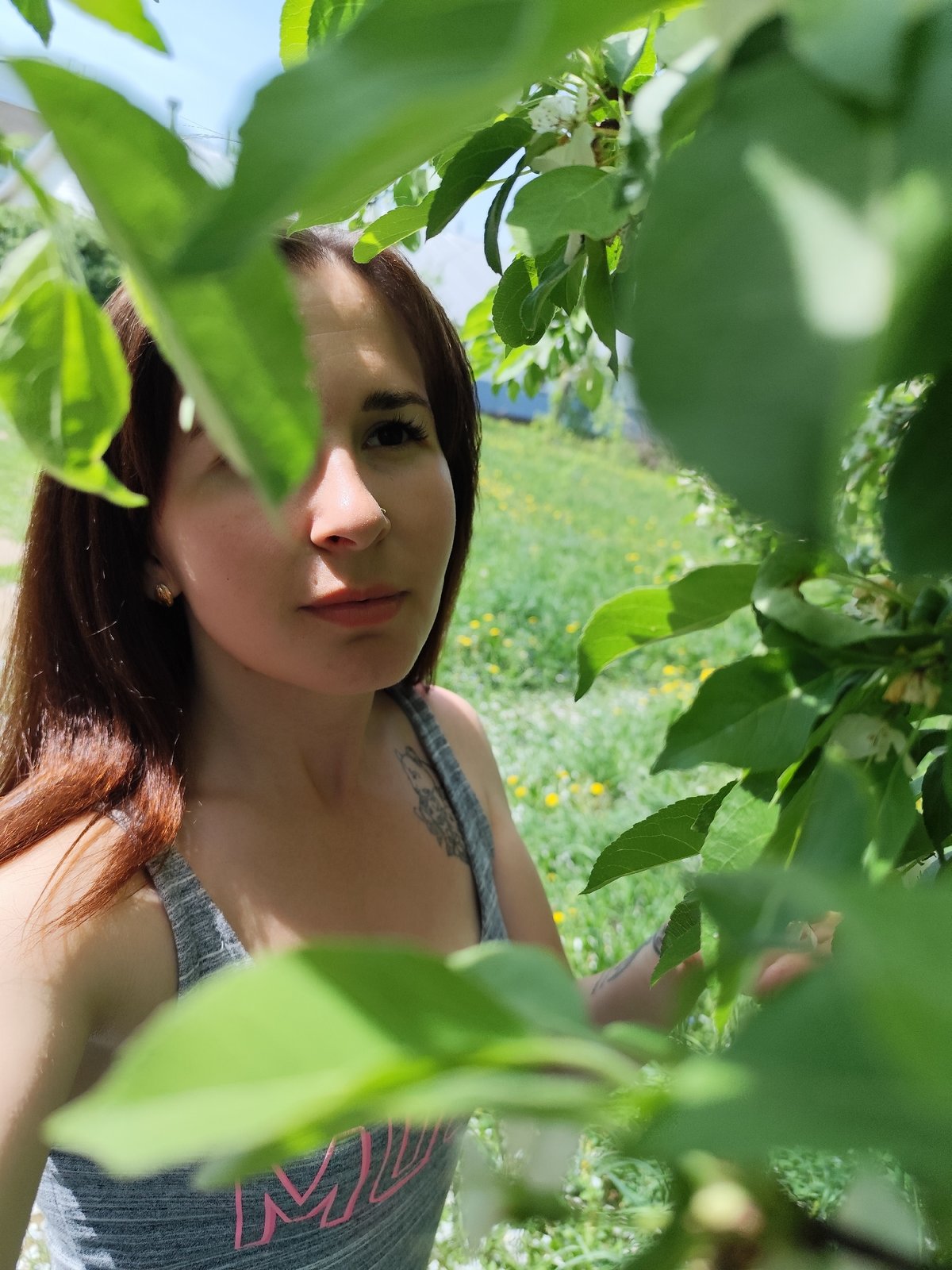Woman photographed among green foliage in Фоки, Russia