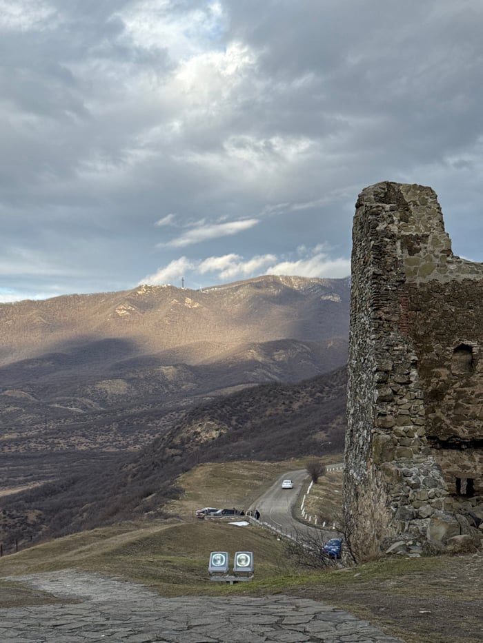 Tourists visit historic Jvari Monastery in Mtskheta, Georgia