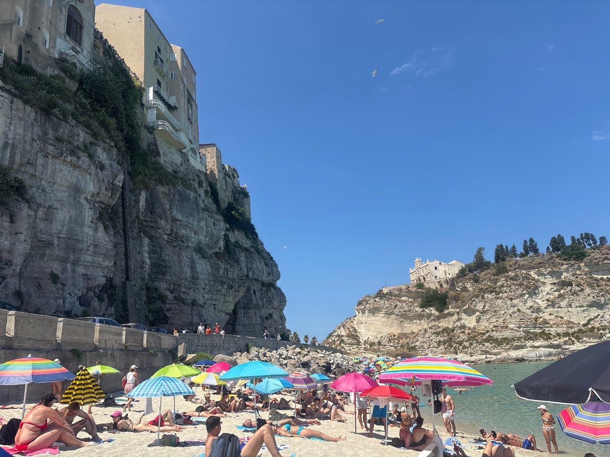 Crowded summer beach day in Tropea, Italy