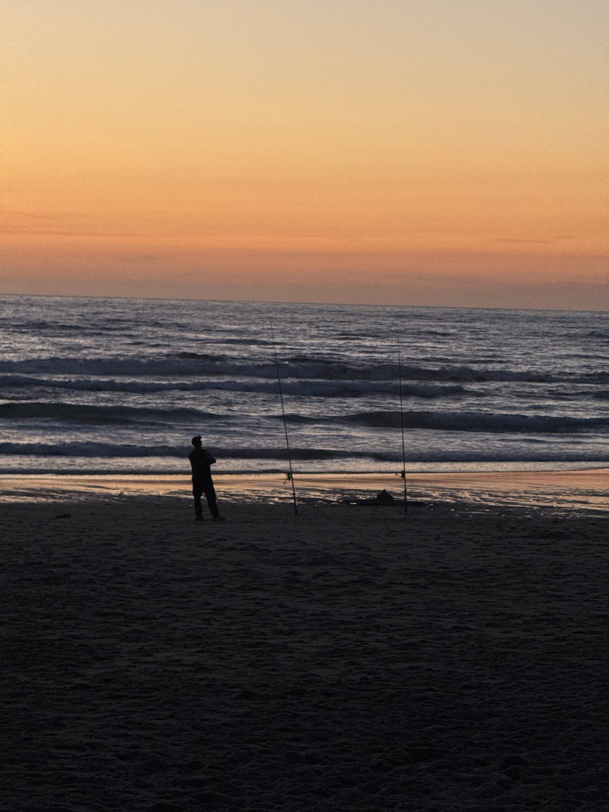 Sunset fishing scene captured on Bidart beach, France