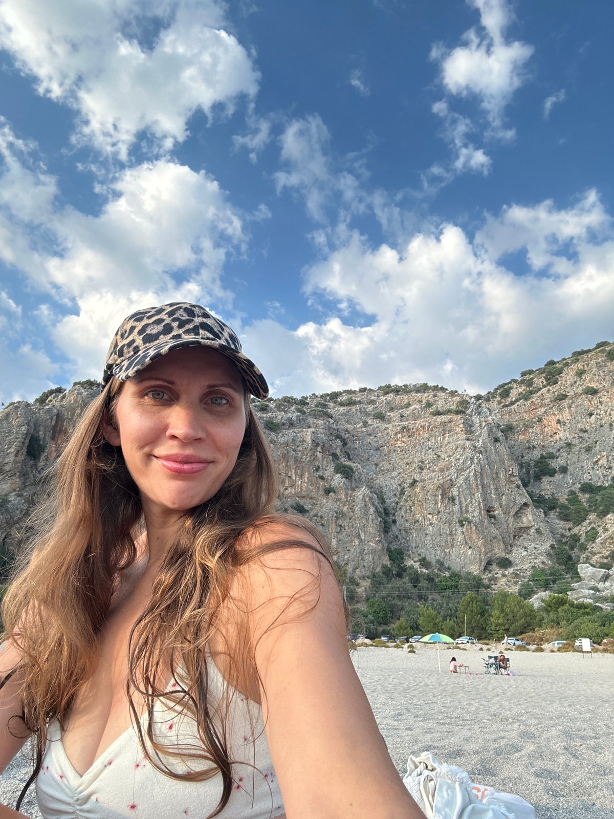 Golden hour on a Fethiye pebble beach, paddleboards and all