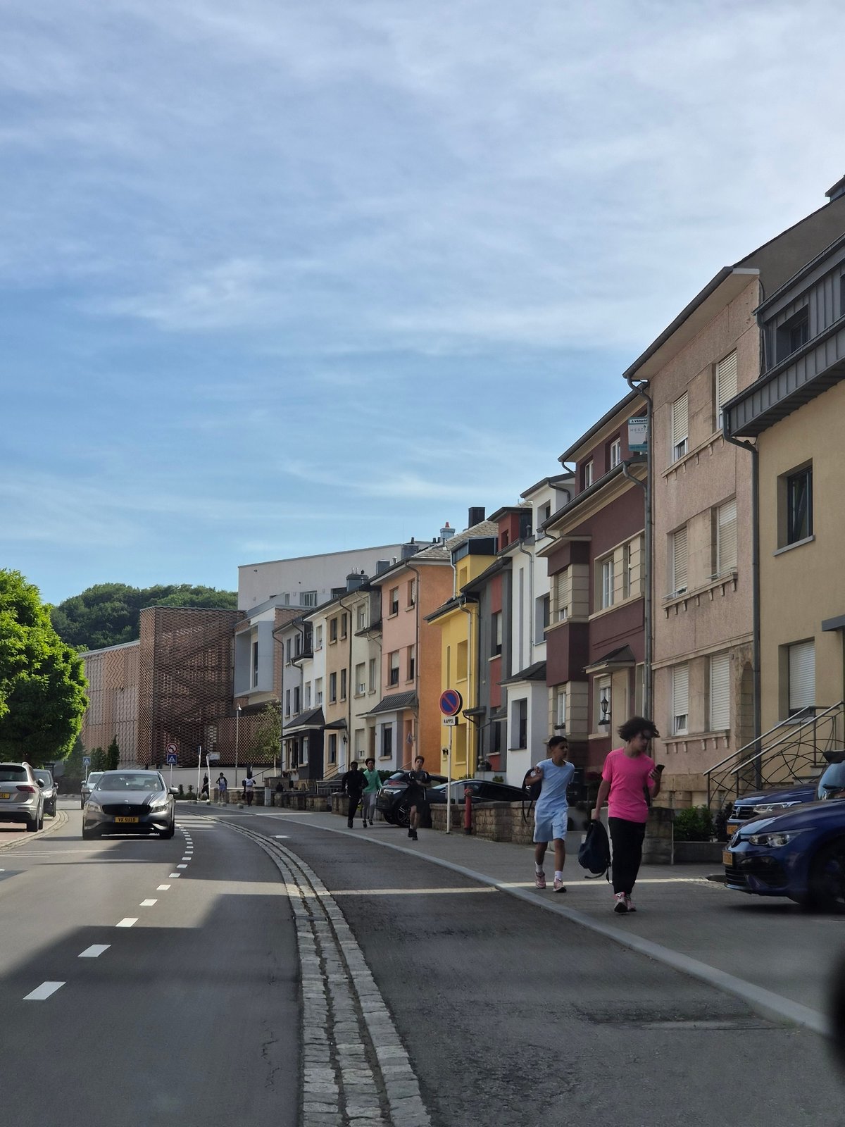Pedestrians walk Differdange streets on quiet Saturday afternoon