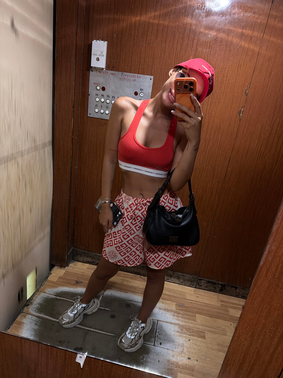 Red outfit mirror selfie in a Burgas elevator