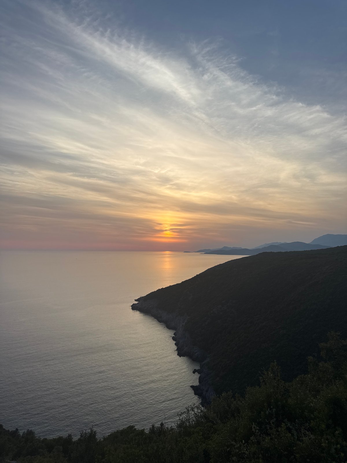 Adriatic sunset framed through hands and glasses, Zagora