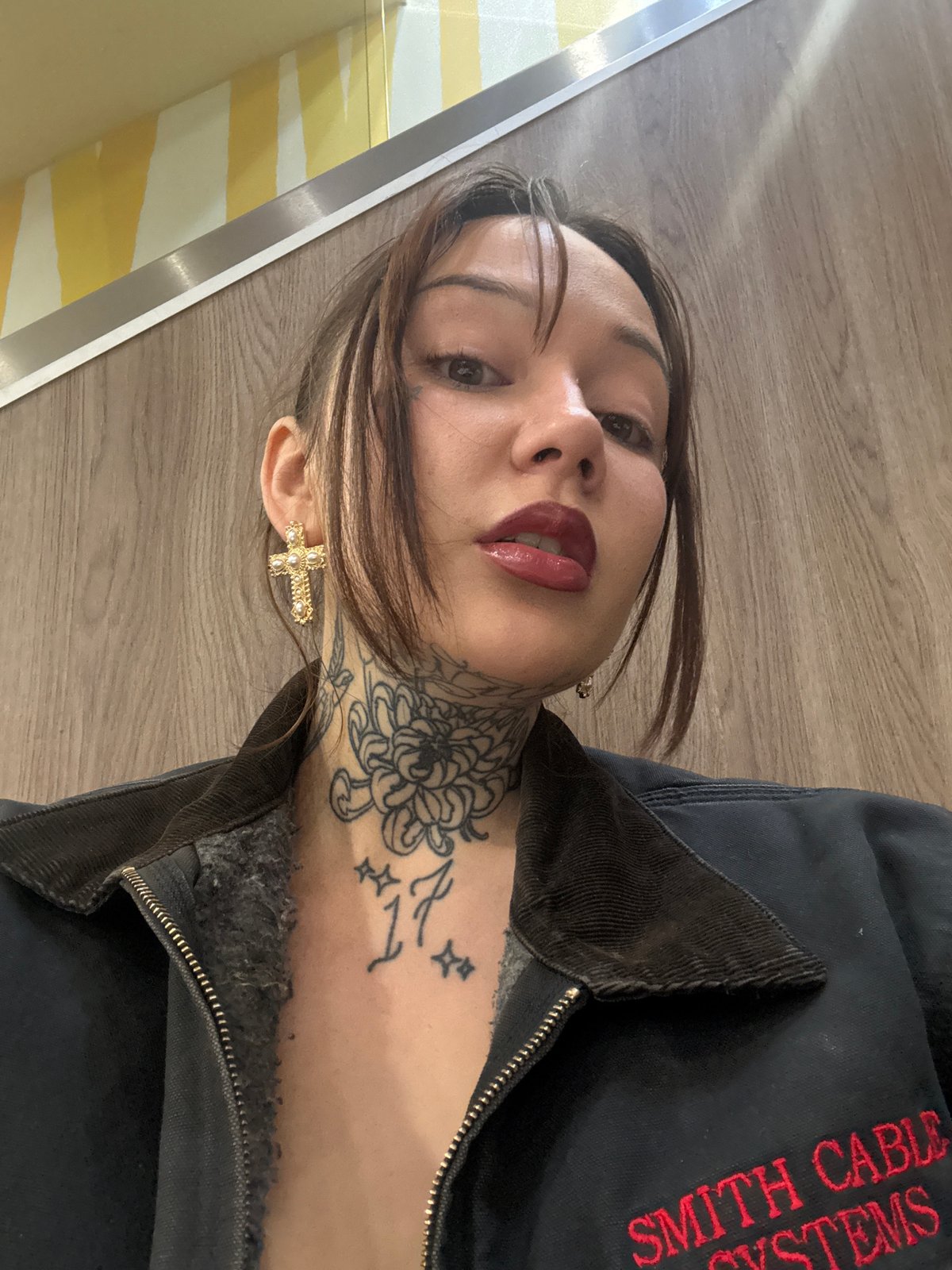 Woman takes high-angle selfie on wooden floor in London