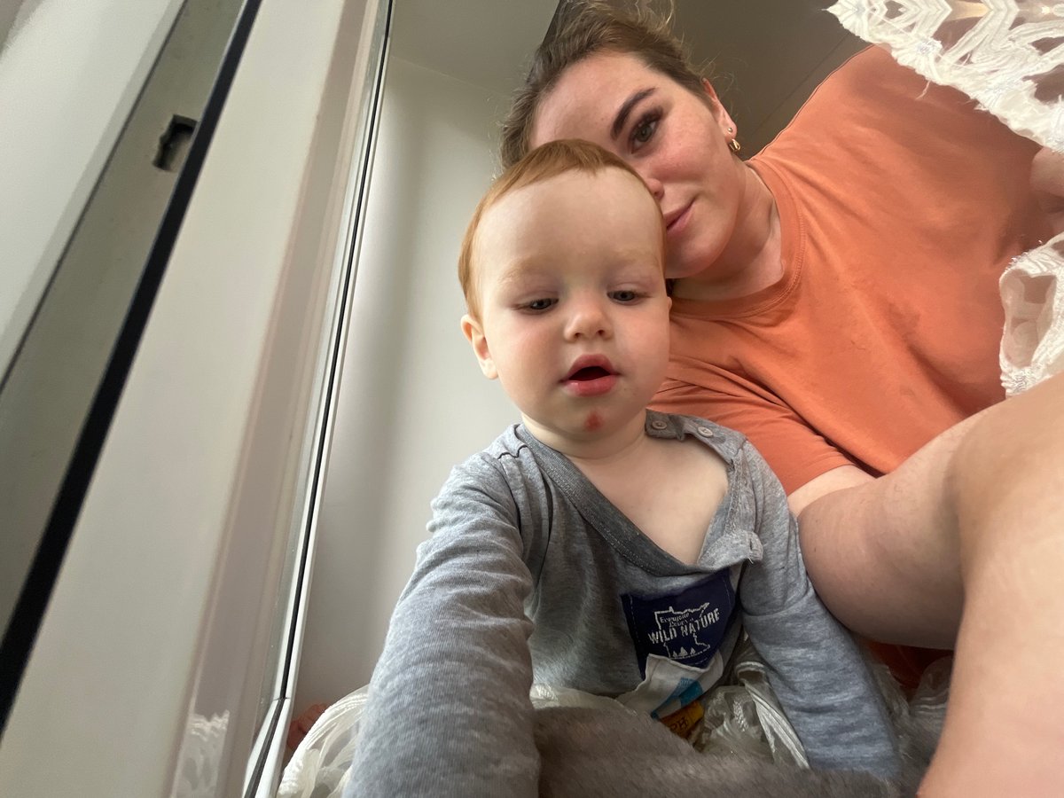 Lazy summer morning at home with a toddler and a cat