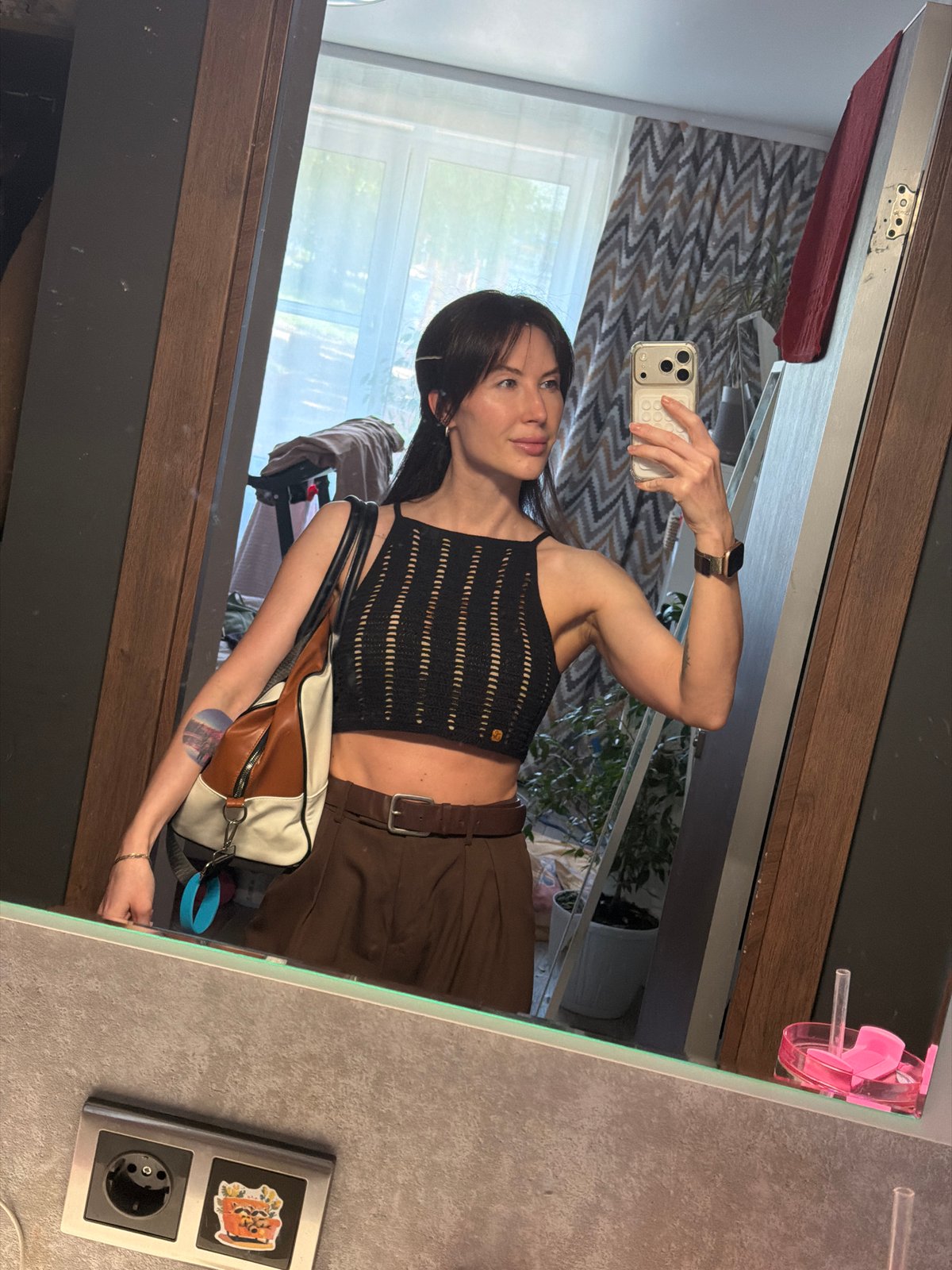 Woman takes morning selfie in mirror in Perm