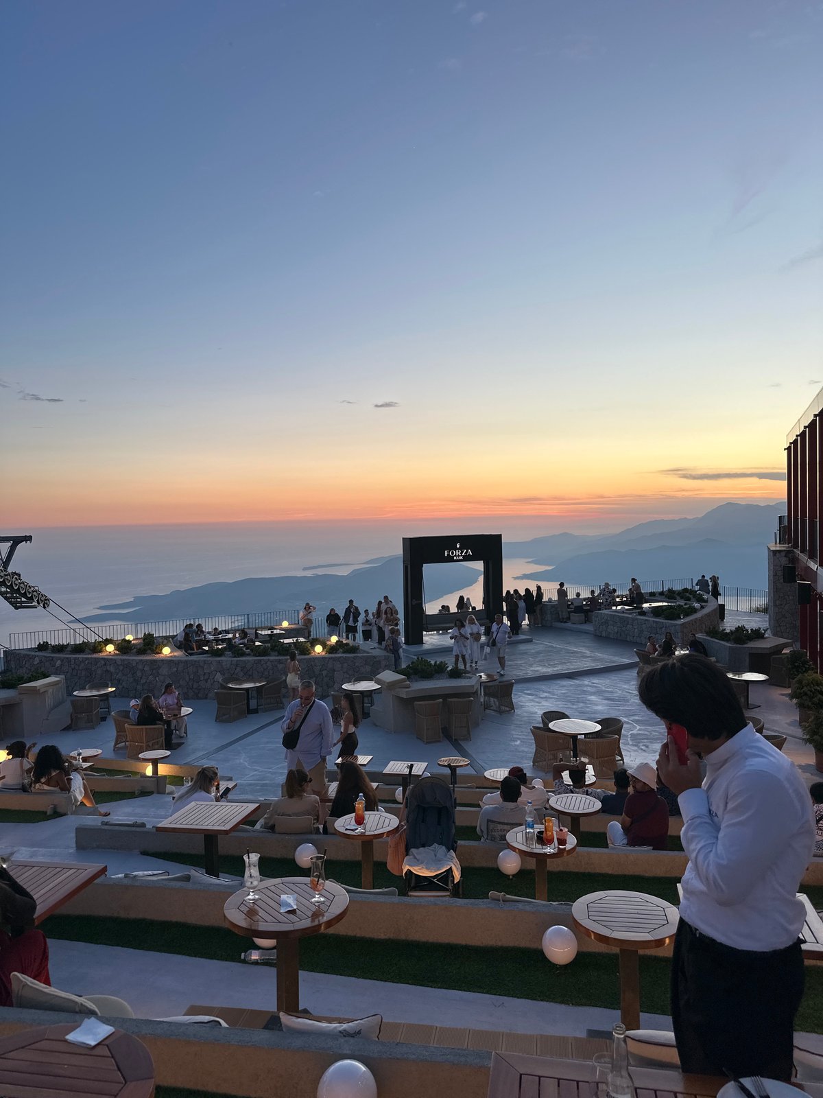 Tourists enjoy sunset dining and sightseeing around Kuk, Montenegro