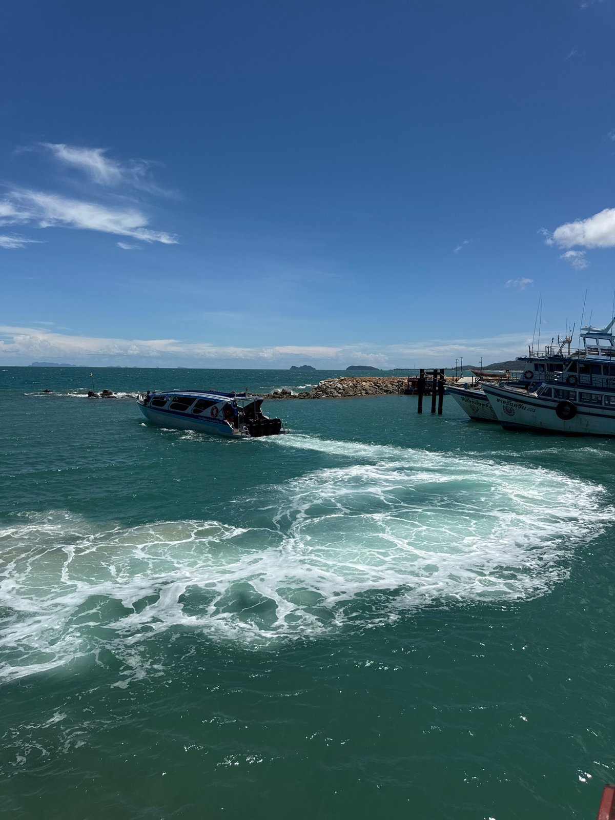 Speedboats and pier activity at Ban Haad Rin, Koh Phangan