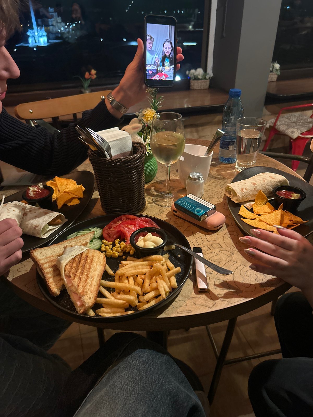 Diners video call during meal at Veliko Tarnovo restaurant
