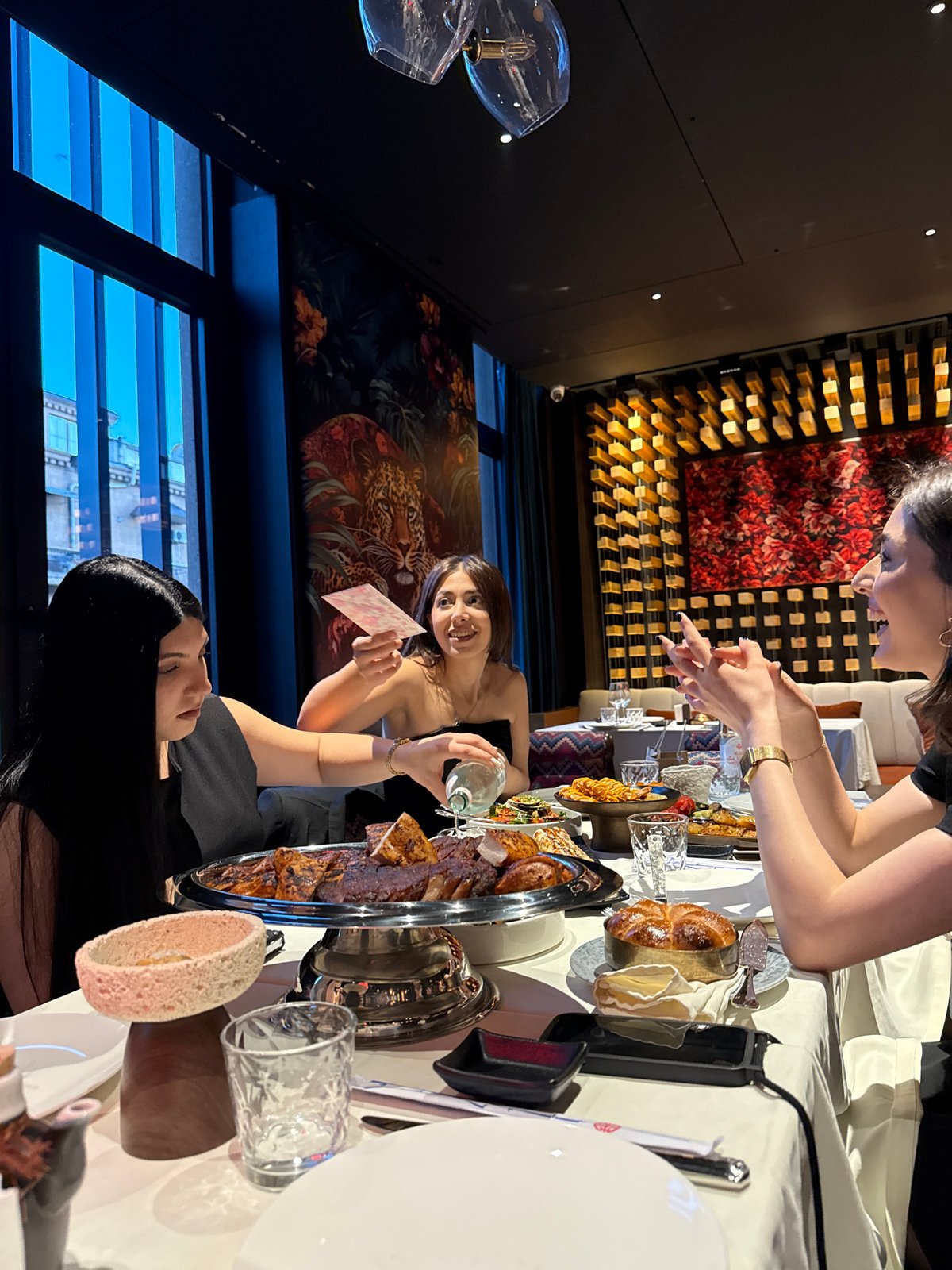Women dine at restaurant table in Yerevan, Armenia