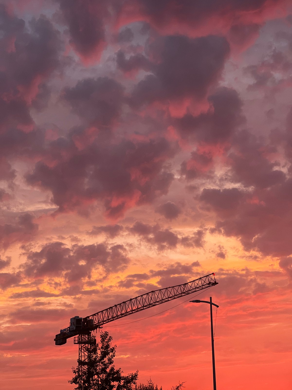 Dramatic midsummer sunset sky over Rotmanka, Poland