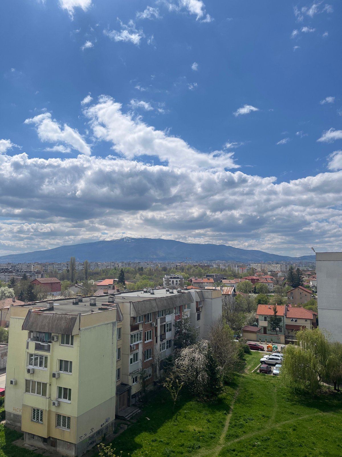Sofia cityscape documented under spring skies with mountain backdrop