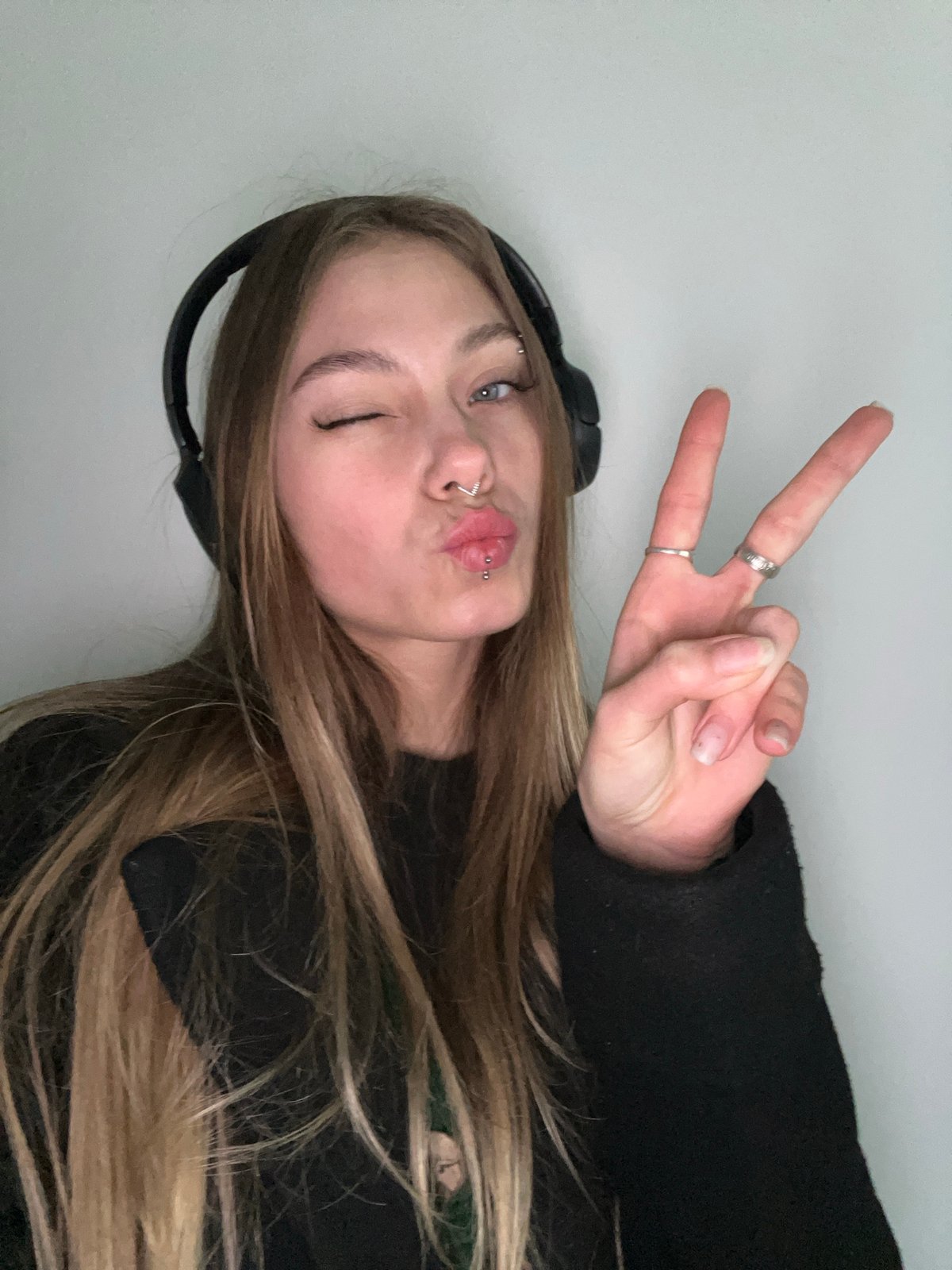 Woman makes peace sign gesture in Russian town