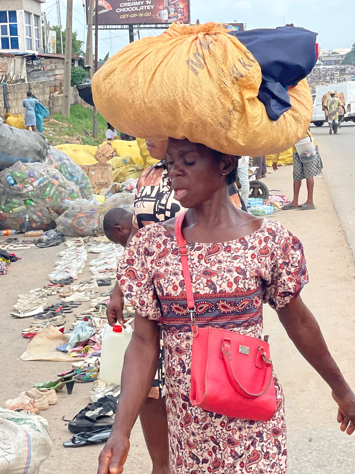Daily market life unfolds in Fegge, Nigeria morning hours