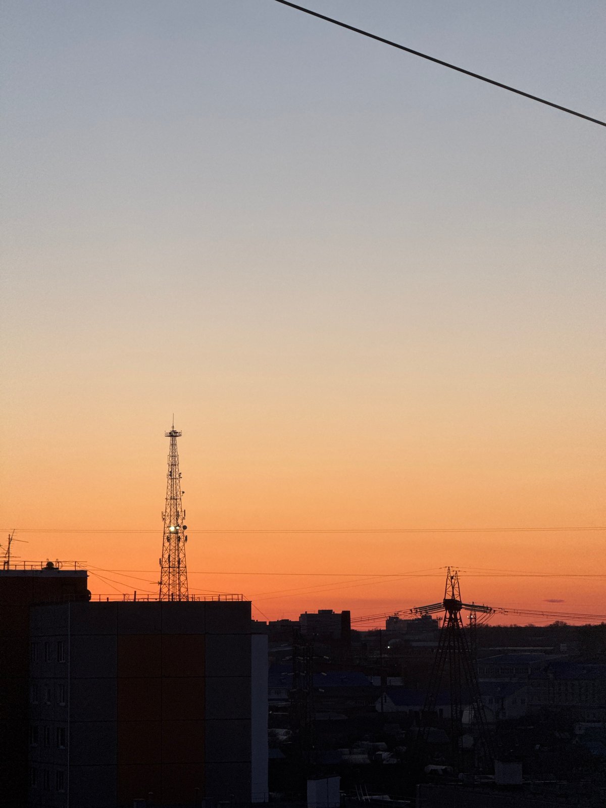 Sunset cityscape captured in time-lapse over Chaikovsky, Russia