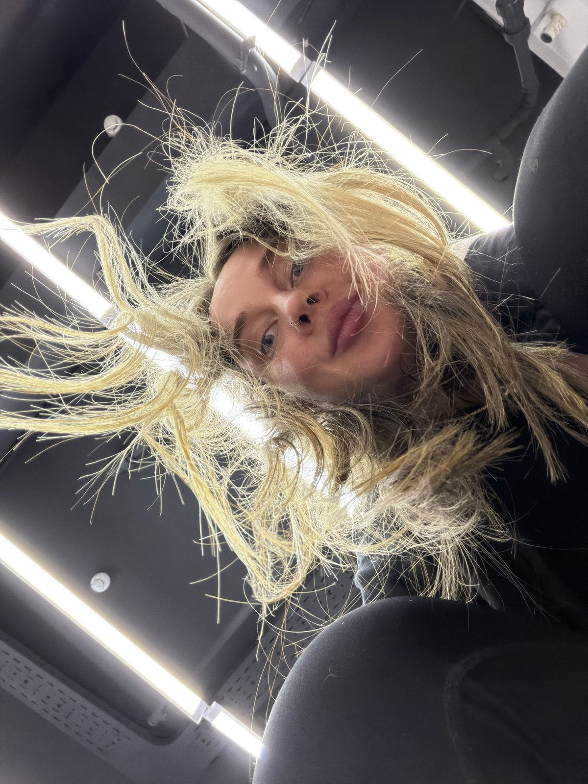 Woman with nose piercing photographed indoors in Moscow