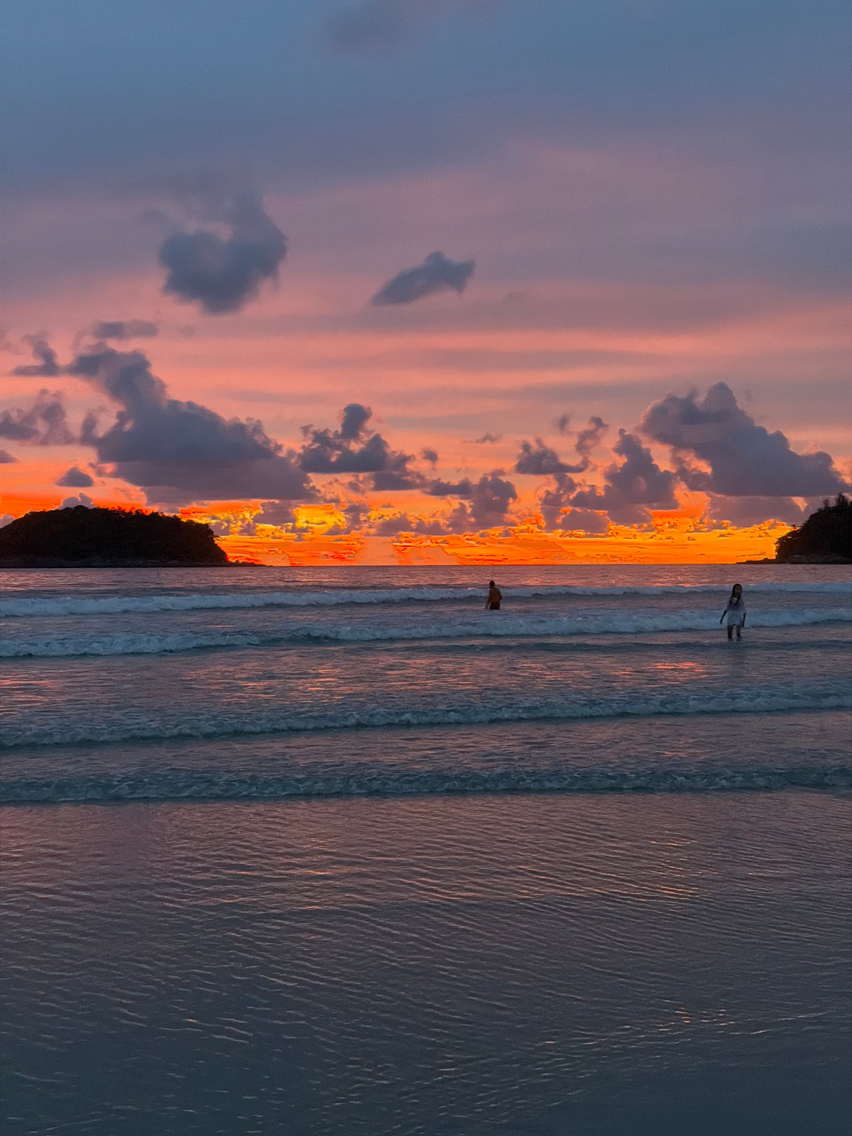 Sky lanterns released at sunset on Karon Beach