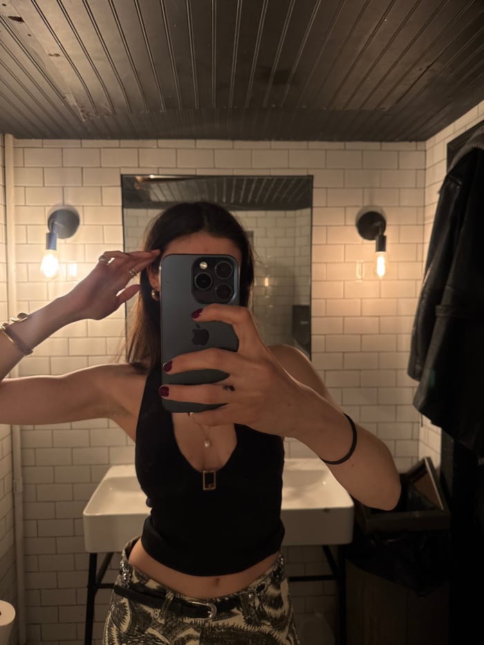 Woman documents late-night NYC establishment visit through personal photographs