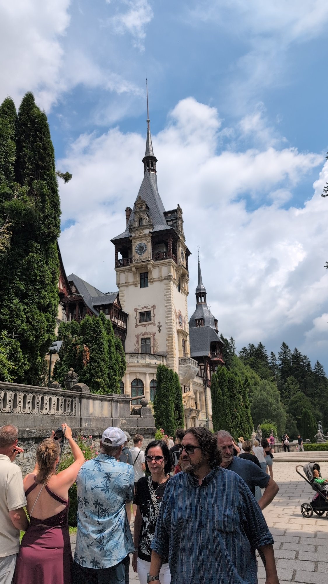 Peles Castle and its Carpathian surroundings on a summer morning