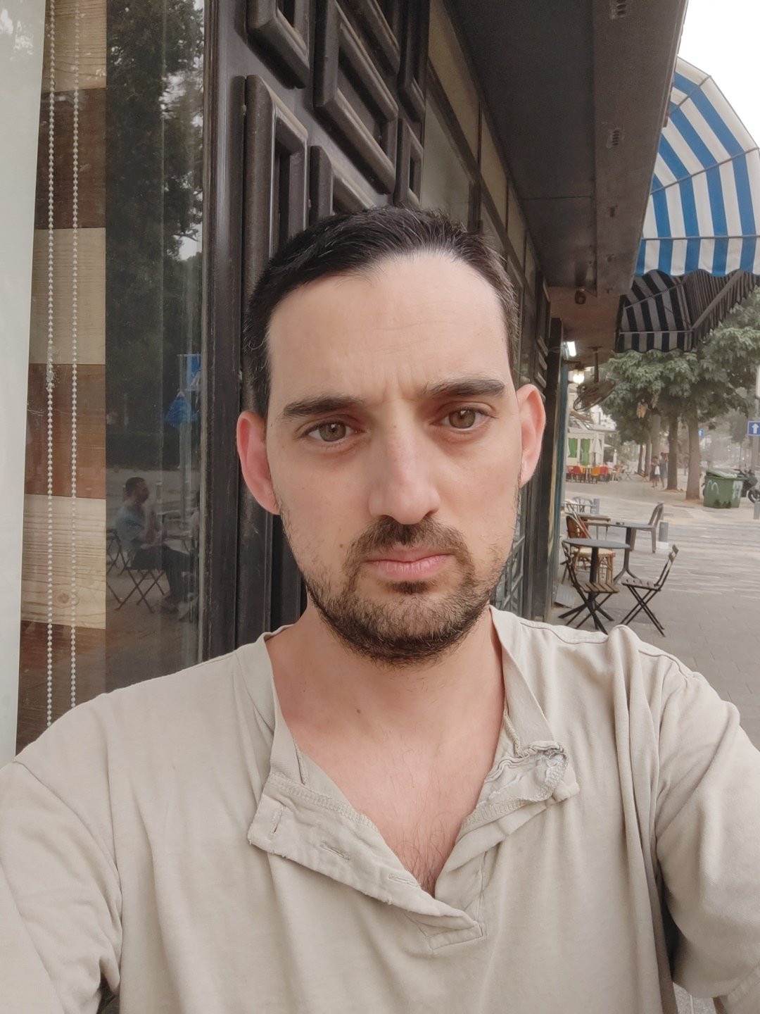 Man photographed near toy-covered table in Tel Aviv